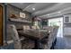 Elegant dining room featuring a large table, stone fireplace, and stylish décor at 3829 Waycross Dr, Columbus, IN 47203