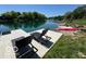 Enjoy the lake view from your backyard dock with two sunbeds, perfect for soaking up the sun and relaxing at 3829 Waycross Dr, Columbus, IN 47203