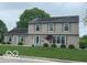 Charming two-story home featuring a well-manicured lawn and classic architectural design at 3829 Waycross Dr, Columbus, IN 47203