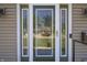 Close-up of the glass-paneled front door, offering an elegant and welcoming entrance at 3829 Waycross Dr, Columbus, IN 47203