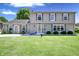 Charming two-story home with green shutters, well-manicured lawn, and inviting front entrance at 3829 Waycross Dr, Columbus, IN 47203