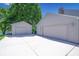 Spacious detached two-car garage and additional single-car garage with ample driveway parking at 3829 Waycross Dr, Columbus, IN 47203
