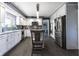 Spacious kitchen featuring stainless steel appliances, an island, and custom cabinetry at 3829 Waycross Dr, Columbus, IN 47203
