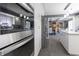 Bright, modern kitchen with stainless steel appliances and white cabinets with an open floor plan at 3829 Waycross Dr, Columbus, IN 47203