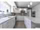 Open kitchen with granite countertops, custom cabinetry and stainless steel appliances at 3829 Waycross Dr, Columbus, IN 47203