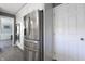 Bright kitchen with modern stainless steel refrigerator and white door at 3829 Waycross Dr, Columbus, IN 47203