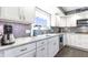 Bright kitchen featuring granite countertops and modern stainless steel appliances at 3829 Waycross Dr, Columbus, IN 47203
