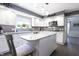 Well-lit kitchen featuring an island and stainless steel appliances at 3829 Waycross Dr, Columbus, IN 47203