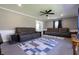 Spacious living room featuring neutral wall paint, two brown couches, and a ceiling fan at 3829 Waycross Dr, Columbus, IN 47203