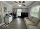 Bright living room features hardwood floors, lots of natural light, and ample seating at 3829 Waycross Dr, Columbus, IN 47203