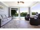 Relaxing sun room with lake view, three large windows, and comfortable seating at 3829 Waycross Dr, Columbus, IN 47203