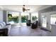 Relaxing sun room with lake view, three large windows, and comfortable seating at 3829 Waycross Dr, Columbus, IN 47203