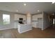 Well-lit kitchen features an island, white cabinets, and an open design for seamless entertaining at 3998 Bozeman Way, Bargersville, IN 46106
