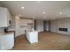 Modern kitchen with island, white cabinets, stainless appliances, open to the living room at 3998 Bozeman Way, Bargersville, IN 46106