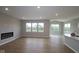 Spacious living room with fireplace and large windows offering natural light and views at 3998 Bozeman Way, Bargersville, IN 46106