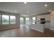 Bright, open-concept living area flows into kitchen with large windows and hardwood floors at 3998 Bozeman Way, Bargersville, IN 46106