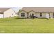 Spacious backyard features a patio with a grill and outdoor seating, and lush green lawn at 410 Angelina Way, Avon, IN 46123