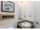 Neat half bathroom featuring vanity with countertop, decorative mirror and fixtures at 410 Angelina Way, Avon, IN 46123