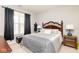 Cozy bedroom featuring a comfortable queen-sized bed and a window with natural light at 410 Angelina Way, Avon, IN 46123