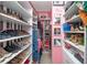 Walk-in closet with built-in shelving and ample storage space for shoes and clothing at 410 Angelina Way, Avon, IN 46123