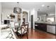 Bright dining area featuring sleek hardwood floors, stainless kitchen appliances, and plenty of space at 410 Angelina Way, Avon, IN 46123