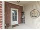 Welcoming front porch entrance of home, featuring a decorative welcome sign at 410 Angelina Way, Avon, IN 46123