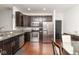 Well-appointed kitchen with stainless steel appliances, granite countertops and breakfast area at 410 Angelina Way, Avon, IN 46123