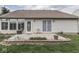 View of the home's backyard featuring a patio, lawn, and exterior of the house at 4675 Walker St, Greenwood, IN 46143