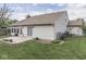 Spacious backyard with a patio, green lawn, and the home's siding at 4675 Walker St, Greenwood, IN 46143