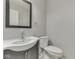 Modern bathroom with a sleek sink, mirror, and toilet offering style and functionality at 4675 Walker St, Greenwood, IN 46143