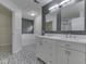 Luxurious bathroom with double vanity, modern mirrors, and a separate tub and shower area at 4675 Walker St, Greenwood, IN 46143