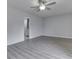 Bright bedroom featuring gray flooring, a ceiling fan and an ensuite bathroom at 4675 Walker St, Greenwood, IN 46143