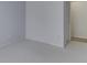 Neutral bedroom with light carpet and walls, featuring an entrance to another room at 4675 Walker St, Greenwood, IN 46143