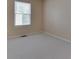 Cozy bedroom featuring neutral carpet and a window with blinds for natural light and privacy at 4675 Walker St, Greenwood, IN 46143