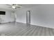 Bedroom featuring gray flooring, a ceiling fan, and two doors leading to other rooms at 4675 Walker St, Greenwood, IN 46143
