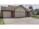 Charming home featuring a three-car garage, brick accents, and a front lawn at 4675 Walker St, Greenwood, IN 46143