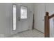 Bright foyer with a white tiled floor and glass paneled doors at 4675 Walker St, Greenwood, IN 46143