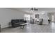 Bright living room features modern furnishings, neutral color palette, and updated flooring throughout at 4675 Walker St, Greenwood, IN 46143