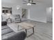 Open living room boasts hardwood floors, a ceiling fan, and plenty of natural light at 4675 Walker St, Greenwood, IN 46143