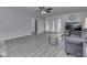 Spacious living room with hardwood floors, ceiling fan, and a comfortable gray sofa at 4675 Walker St, Greenwood, IN 46143