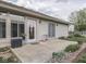 Backyard patio area attached to the home, with a sliding glass door at 4675 Walker St, Greenwood, IN 46143