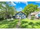 A well-maintained yard with a walkway leading to the house featuring a fire pit and lawn at 5015 Carrollton Ave, Indianapolis, IN 46205