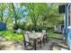 Backyard patio with a table and chairs for outdoor dining at 5015 Carrollton Ave, Indianapolis, IN 46205