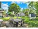 Backyard patio with a table and chairs for outdoor dining at 5015 Carrollton Ave, Indianapolis, IN 46205
