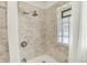 Bathroom featuring tiled walls, shower, and modern finishes at 5015 Carrollton Ave, Indianapolis, IN 46205