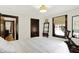 Bright bedroom featuring warm wood trim, a ceiling fan, and modern decor at 5015 Carrollton Ave, Indianapolis, IN 46205