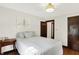 Comfortable bedroom with hardwood floors and neutral colors at 5015 Carrollton Ave, Indianapolis, IN 46205