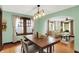 Inviting dining room featuring a wood table, stylish lighting, and neutral decor at 5015 Carrollton Ave, Indianapolis, IN 46205