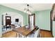 Inviting dining room featuring a wood table, stylish lighting, and neutral decor at 5015 Carrollton Ave, Indianapolis, IN 46205