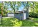 This detached garage features a garage door and a fenced yard at 5015 Carrollton Ave, Indianapolis, IN 46205